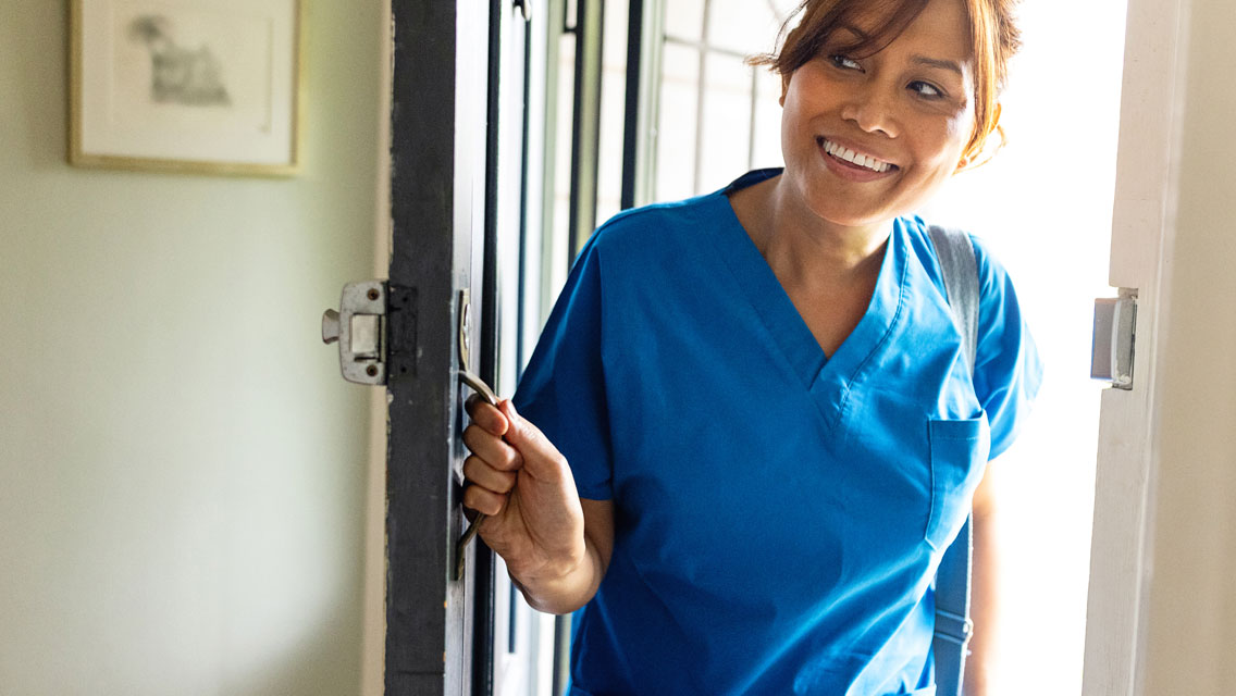 A nurse enters a patient's room
