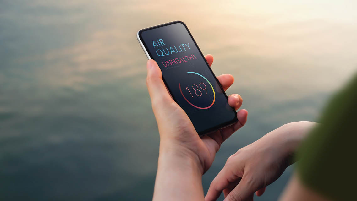 a person checks the air quality on their phone