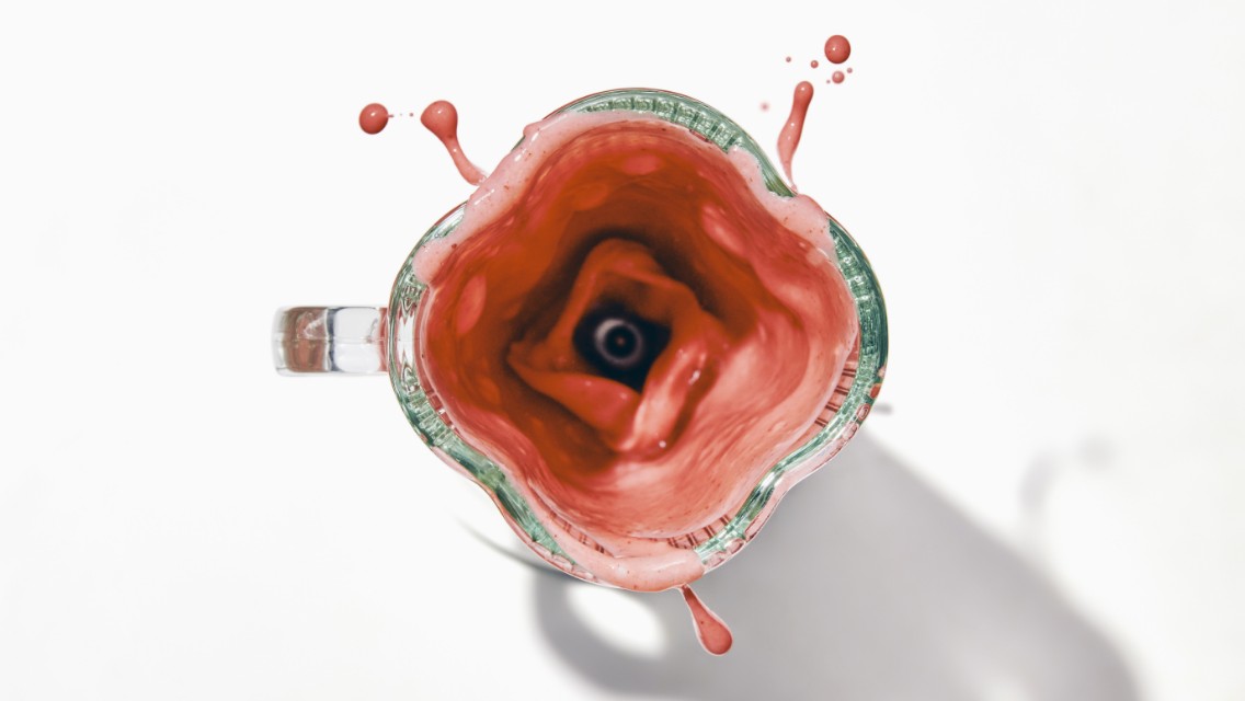 A blender filled with the strawberry sunrise smoothie.