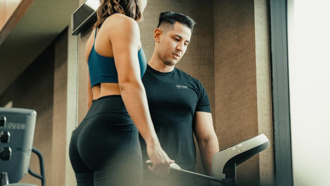 Trainer and client using the InBody scale at Life Time