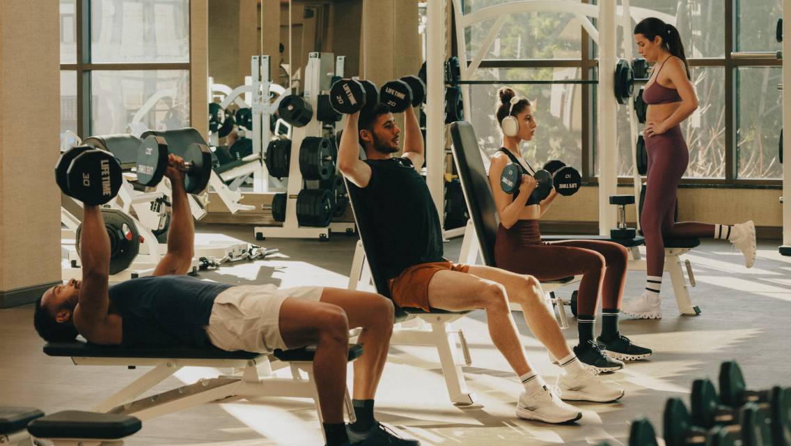 people lifting weights in a group
