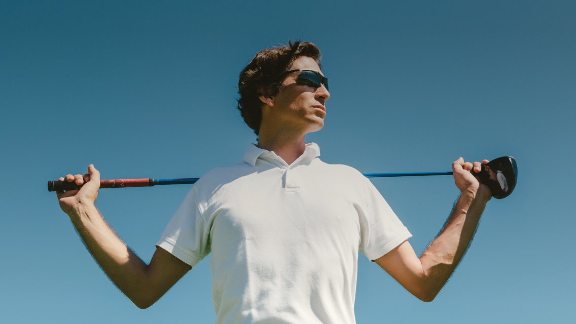 man holding golf club