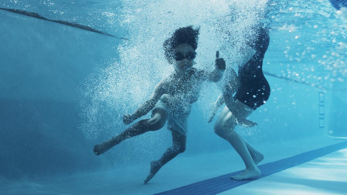 child swimming in the pool
