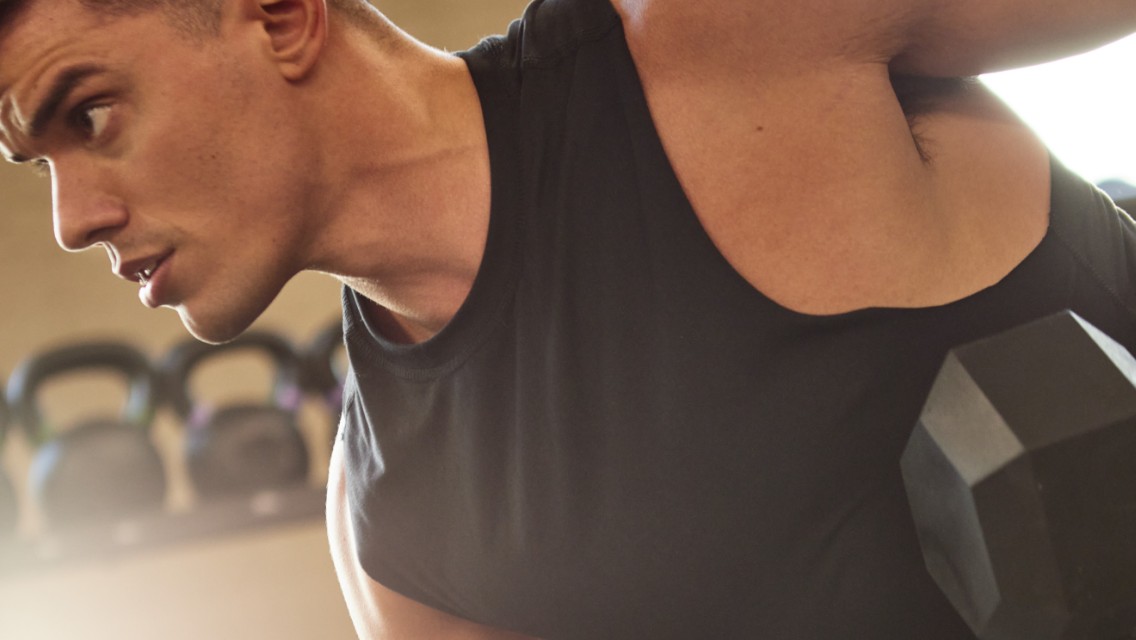 person lifting a dumbbell