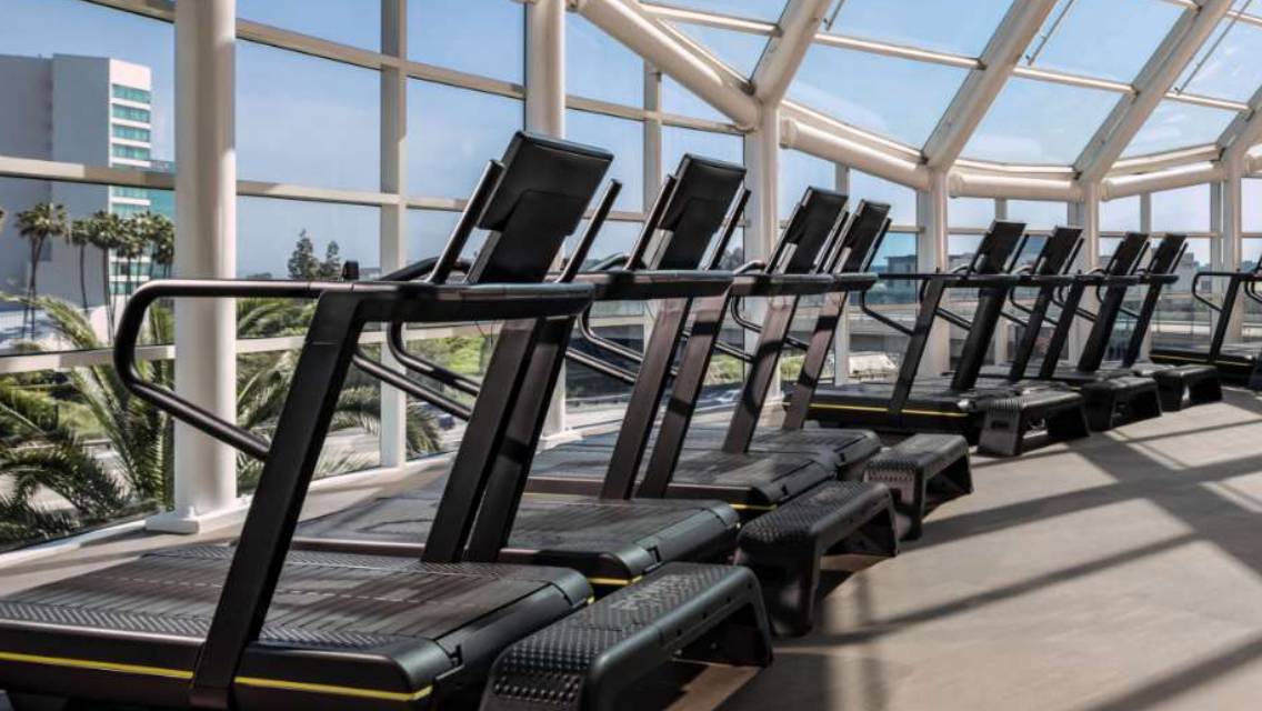 row of workout machines on workout floor