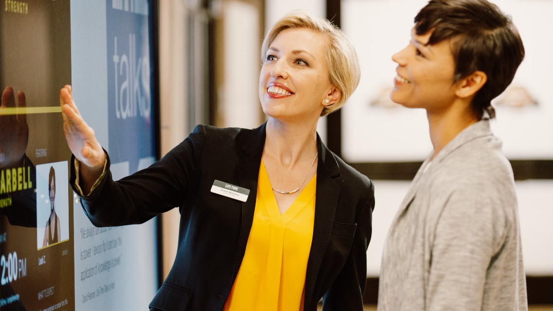 A team member at Life Time Living assisting a resident.