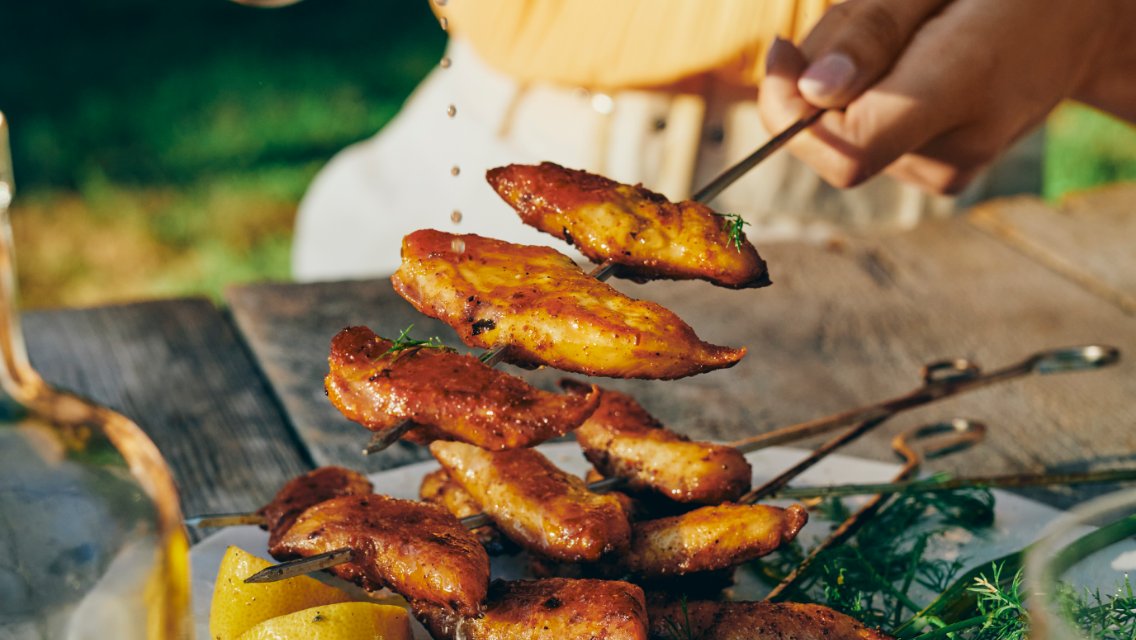 Lemon-pepper marinade on chicken skewers.