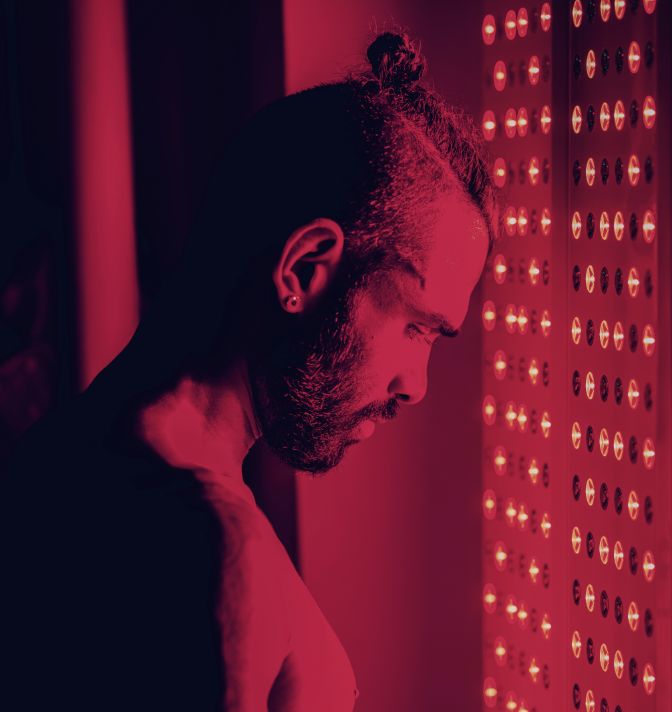 A man inside an infrared sauna.