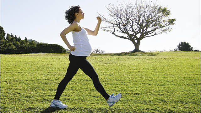 pregnant woman power walking