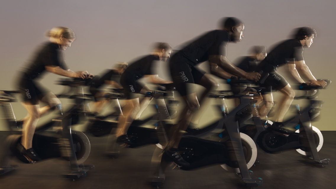 People taking a cycle class at Life Time