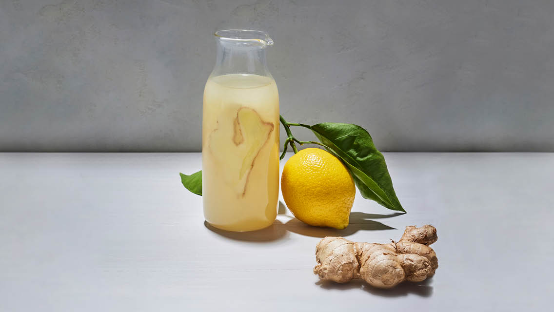 a carafe filled with Aviva Romm's ginger wellness drink