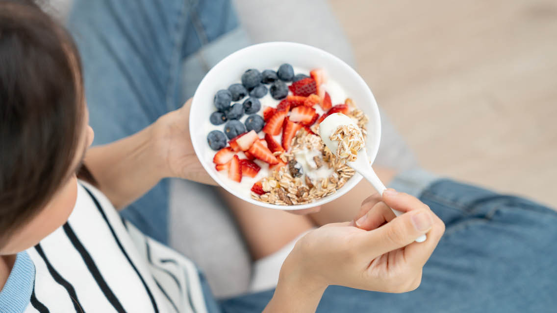 a person it's yogurt with fruit