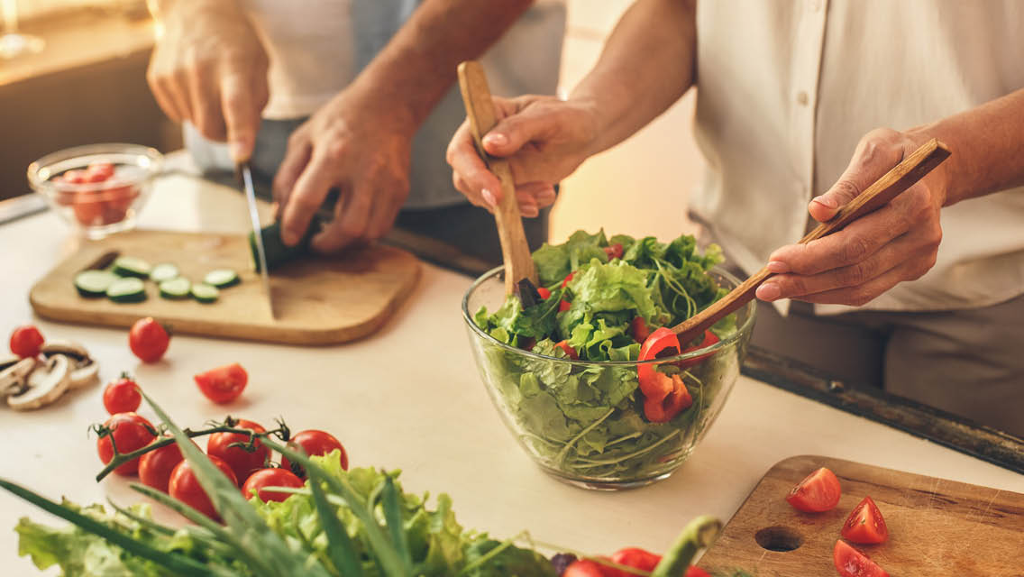 people make salads in their kitchen