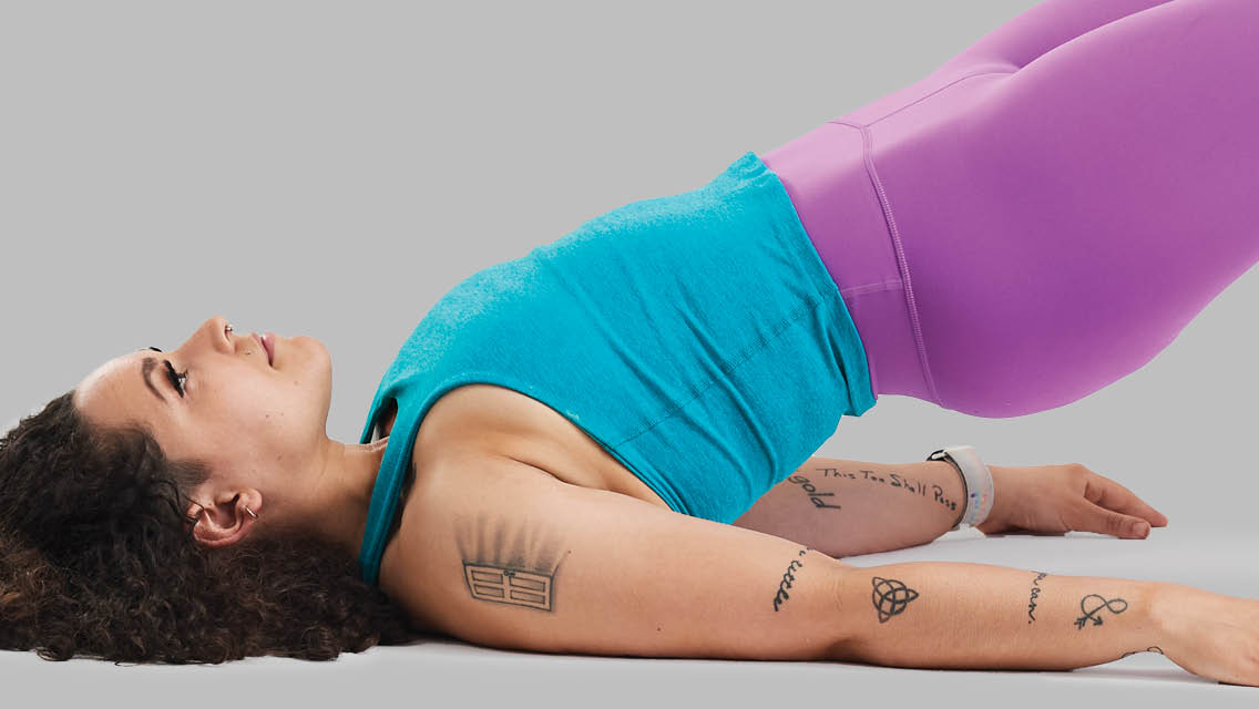 a woman hold bridge pose