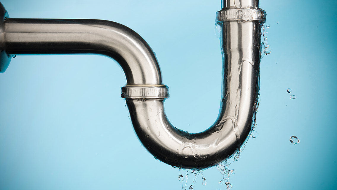 A leaky faucet is pictured.