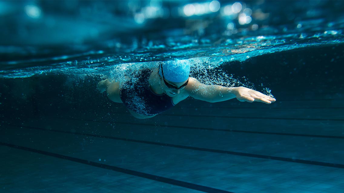 Person swimming laps in pool