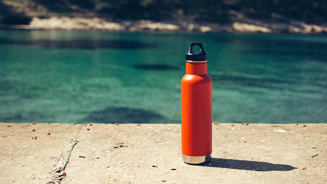 a sports bottle poolside