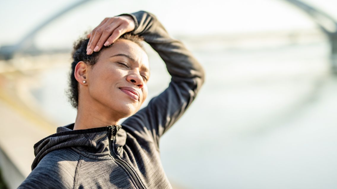 Person with hand on her head