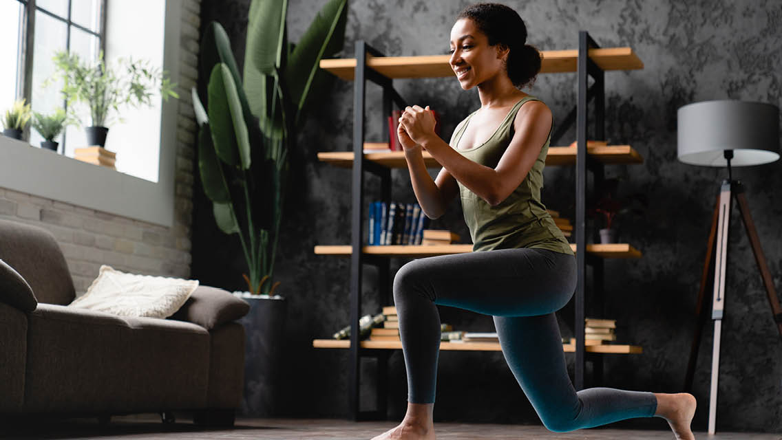a woman performs a lunge