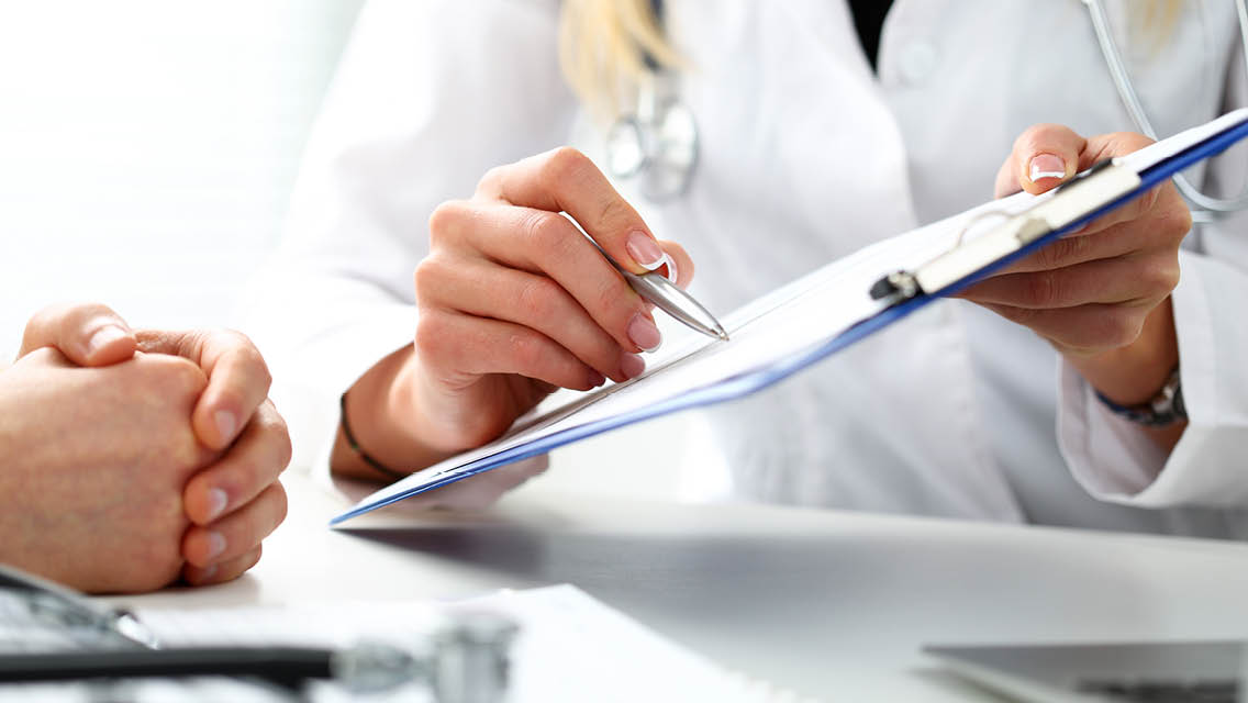 a person consulting with their medical practitioner