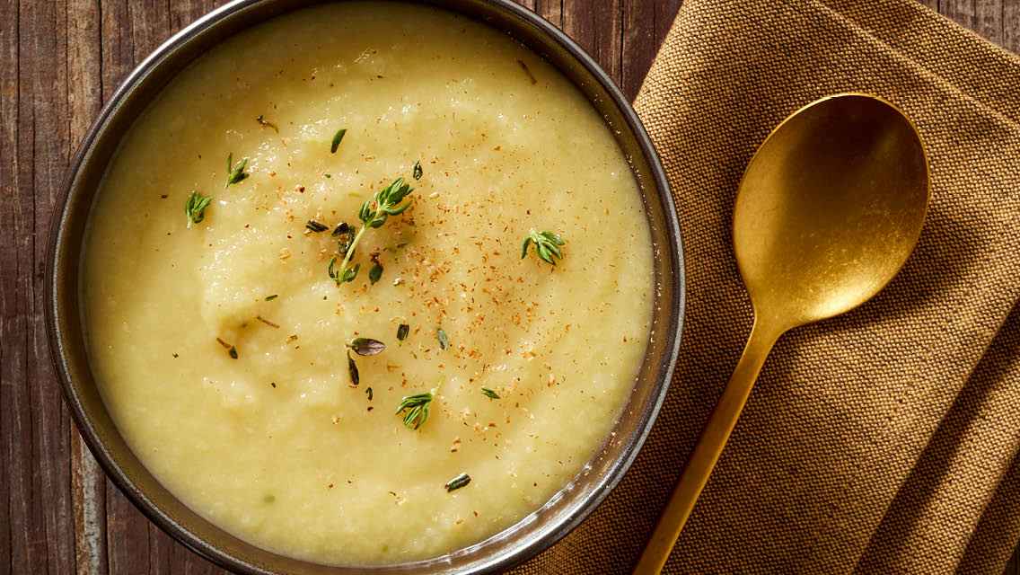 nov22-cc-pear-parsnip-soup a bowl of pear parsnip soup