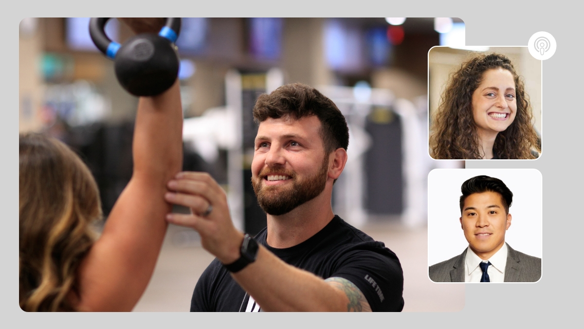 trainer helping someone lift a kettlebell