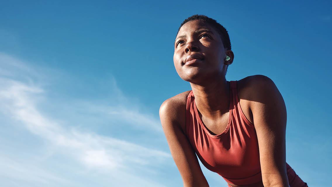 a young woman outside wearing fitness apparel