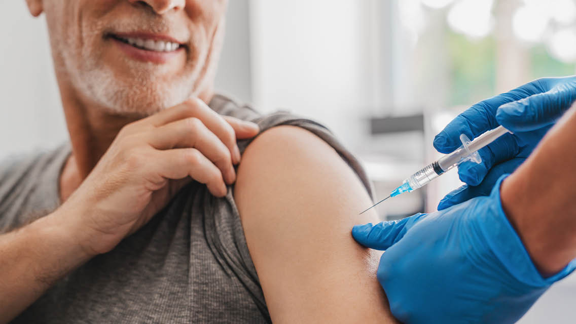 a man gets a vaccine shot